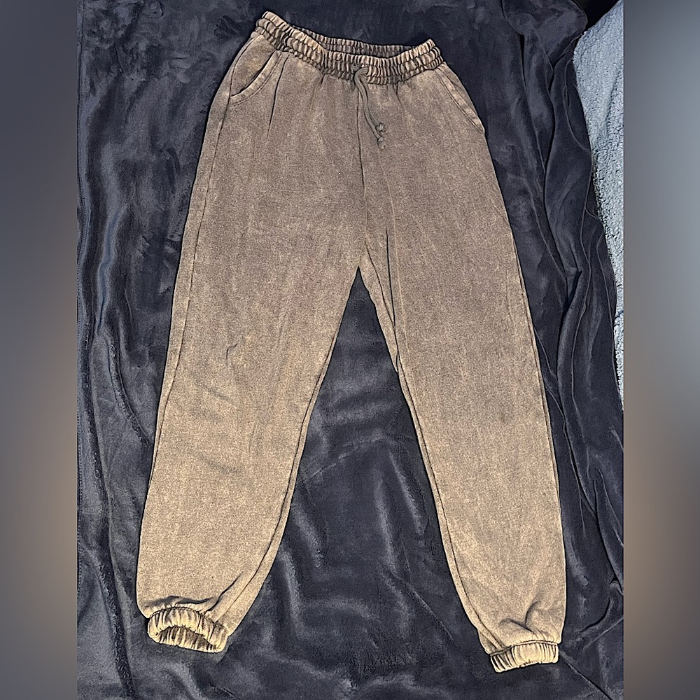 Washed-out gray sweatpants.